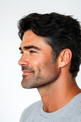 Obraz premium Creative of style for aging men. Trendy men's low fade haircut - midlife white man with black hair. Pure white solid background. A modern and graceful man smiling naturally.