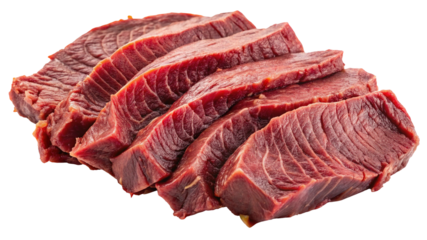 Closeup of several slices of raw beef meat on a black background