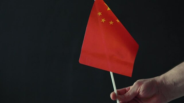  Closeup of a flag of China. Chinese culture and  language concept.