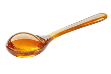 The golden promise of pure honey slowly dripped from a glass spoon ready to sweeten life s on transparent background