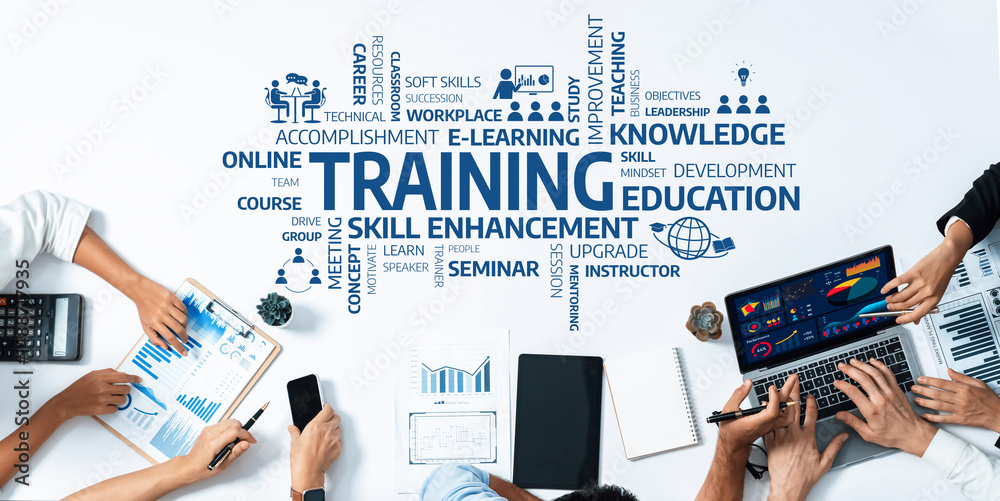 Fototapete a dynamic workspace showcasing training and skill enhancement concepts with charts, laptops, and col
