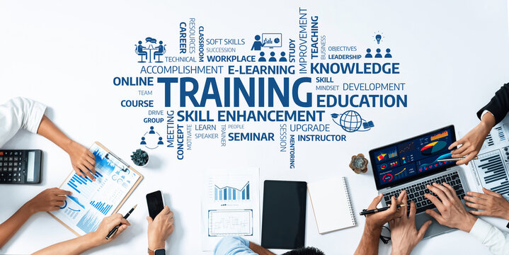 A dynamic workspace showcasing training and skill enhancement concepts with charts, laptops, and collaborative teamwork for professional growth and online education. Amity