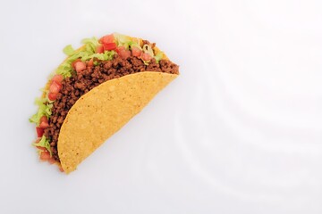 Single taco with ground beef filling
