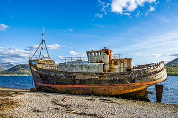 Corpach Wreck or Old Boat of Caol and Nevis Range Mountains, Caol Beach, Corpach, Fort William, Highland, Scotland, UK
