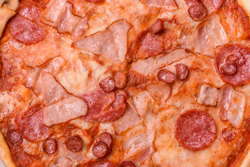 Italian pepperoni pizza with cheese and salami, tomatoes and sauce