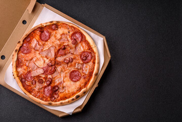 Italian pepperoni pizza with cheese and salami, tomatoes and sauce
