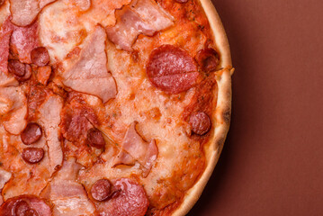 Italian pepperoni pizza with cheese and salami, tomatoes and sauce