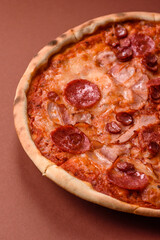 Italian pepperoni pizza with cheese and salami, tomatoes and sauce