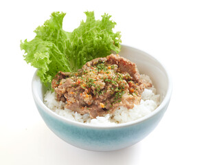 Isolated Delicious Bowl of Rice Topped With Seasoned Spicy Minced Meat and Fresh Lettuce Served in a Ceramic Dish
