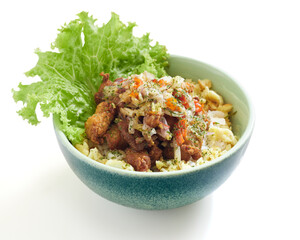 Isolated Crispy Fried Chicken Bowl With Sambal Matah and Fresh Lettuce and Savory Slaw Served in a Blue Ceramic Dish