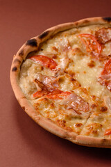 Italian pizza with chicken and bacon, cheese, tomatoes and sauce