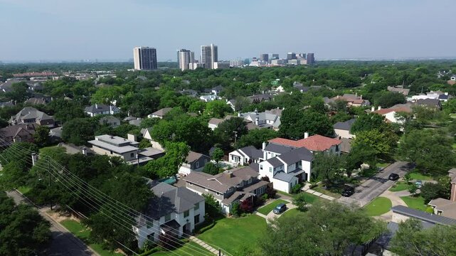 Downtown skyline high-rise from affluent Preston Hollow neighborhood inner suburb Dallas, expensive mansion houses modern design luxury amenities, green sustainable community mature landscaping