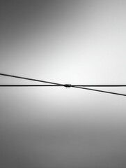 Two intersecting lines against a neutral backdrop.