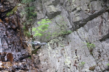 Drone flying over a waterfall.