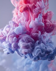 Fototapeta premium Abstract swirling pink and blue ink in water. This mesmerizing shot captures the captivating dance of colors and textures as ink diffuses.