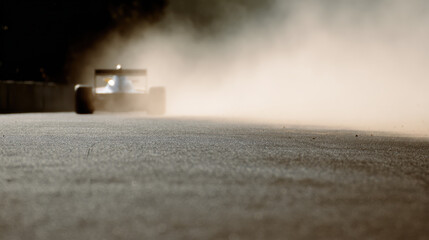thrilling moment at start of race emphasizing wheels of cars as they burst into action