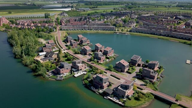 Aerial view of recreational lakes Rietplas and Oosterlaakplas, modern luxury homes by the water in dutch city of Houten, Province Utrecht