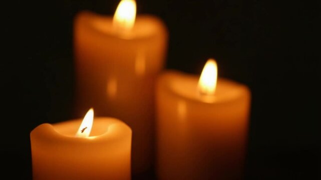 Warm candlelight creates a serene atmosphere during a cozy gathering