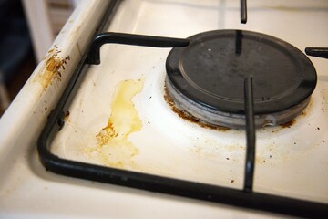Dirty gas stove close up