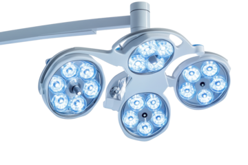 Surgical instruments and operating room lights arranged on white sterile background for medical procedures with advanced technology