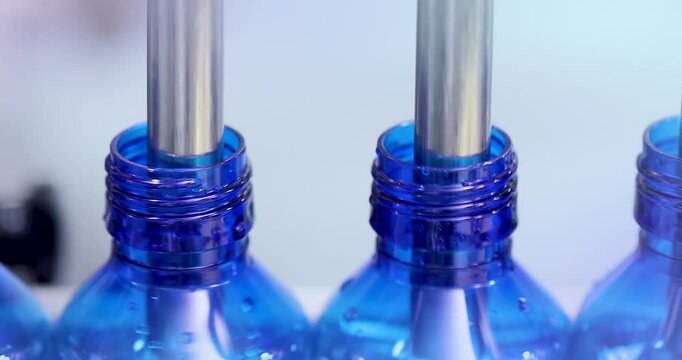 Pharmaceutical manufacturing line for liquid medicine production, automatic bottle filling machine for syrup, sanitizer, or gel in plastic bottles at sterile industrial packaging facility