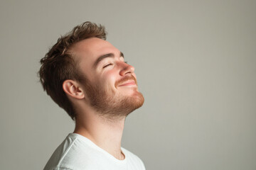 A close up of a man's face with her eyes closed