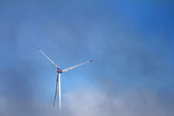 wind turbine against blue sky