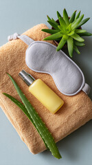 After sun essentials flat lay with towel and skincare items for relaxation
