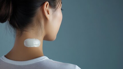 Close-up view of a white patch on a woman's neck.