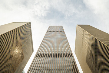 Low-angle view of modern skyscrapers in Manhattan, New York City.