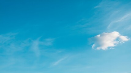 Fototapeta premium Blue sky with single white cloud formation