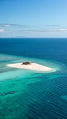 Obraz premium Vast Calm Ocean with Isolated Sandy Island