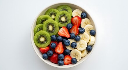 Fruit bowl sliced kiwi strawberries blueberries and banana in ceramic bowl captured in bright daylight for vibrant healthy snack stock photography and recipe illustrations