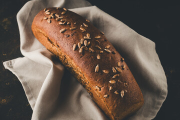 Buckwheat bread. Photo of homemade baking in dark colors.