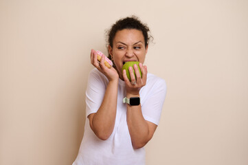 Health-Conscious Choice Concept Depicting a Woman Ambiguously Choosing Between a Green Apple and a...