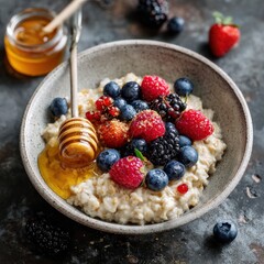Creamy oatmeal topped with fresh berries and a drizzle of honey. A delicious and healthy breakfast!