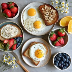 A delicious and healthy breakfast spread featuring fried eggs, toasted bread, fresh fruit, and berries.  The perfect start to the day!