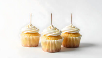 Three Vanilla Cupcakes Topper Mockup. 3 cupcake with wooden toothpick in white background Copy space for your design here. Blank mockup for advertising and promotions, dramatic atmosphere. White ton