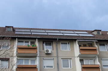 solar panels on apartment building rooftop
