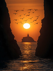Sunset view through rock formations, showcasing a distant lighthouse silhouetted against a vibrant orange sun, encircled by a flock of birds in flight over calm water