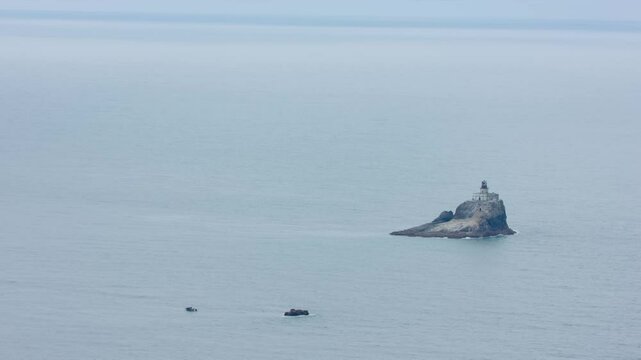 Aerial footage of the famed Terrible Tilly lighthouse, Tillamook Rock Light, situated on a storm-beaten sea stack off Oregon&rsquo;s northern coastline.