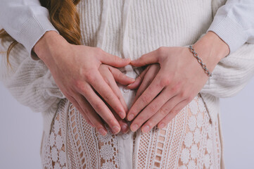 Motherhood concept Mid-section portrait of unrecognizable woman during last months of pregnancy...