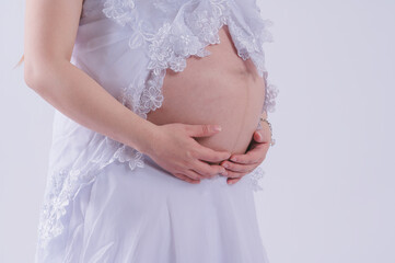 Motherhood concept Mid-section portrait of unrecognizable woman during last months of pregnancy...