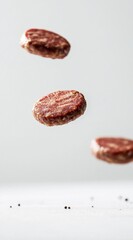 Obraz premium Floating Beef Patties in a Minimalist Kitchen Setting