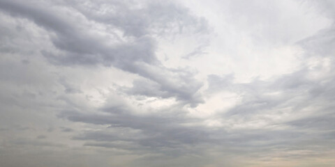 Cloudscape, Dragon-Shaped Dramatic Cloud flowing Through Serene Overcast Sky
