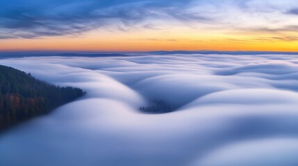 Naklejka premium A bird's-eye view of a thick layer of clouds covering the ground below, creating a soft, blanket-like effect.