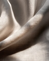 Fototapeta premium Soft textile with delicate folds. Capturing the beauty of the draped fabric with gentle light and shadow play
