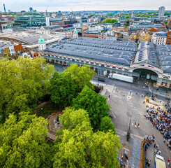 Aerial view of Smithfield Market in London, featuring historic architecture, city streets, and surrounding modern urban buildings