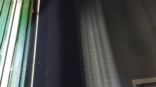 Tyndall effect footage, which is a natural phenomenon that occurs when light passes through a medium containing small particles such as dust, smoke, or colloids.