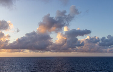 Dramatic Cloudscape Over the Serene Pacific Ocean at Sunset